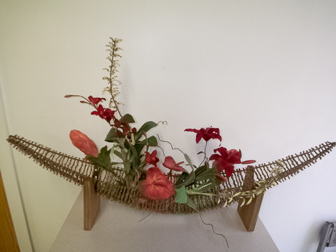 Floral in twig "boat" shape